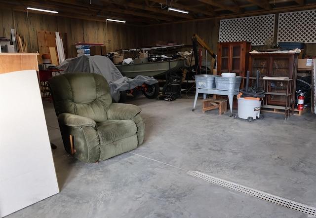 garage featuring wooden walls