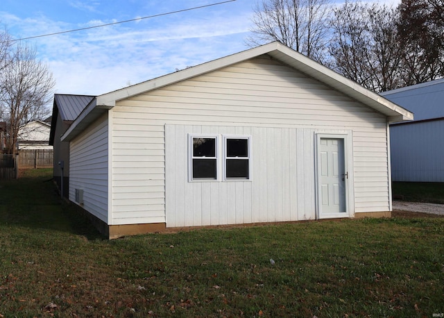 view of outbuilding with a yard