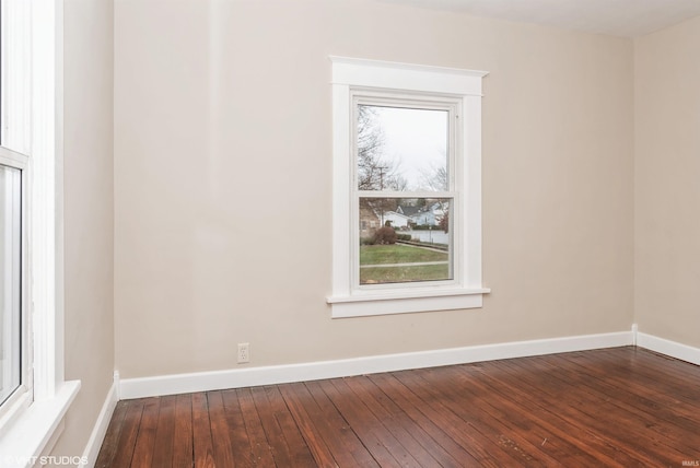 unfurnished room with plenty of natural light and hardwood / wood-style flooring