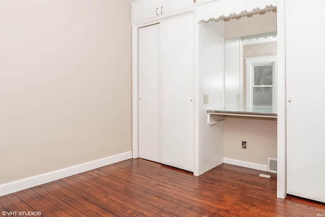 interior space with dark hardwood / wood-style floors