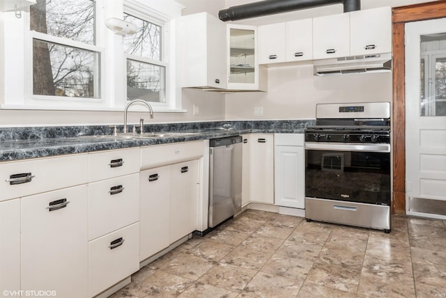 kitchen featuring a healthy amount of sunlight, white cabinetry, sink, and appliances with stainless steel finishes