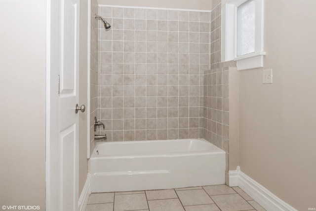 bathroom featuring tile patterned floors and tiled shower / bath