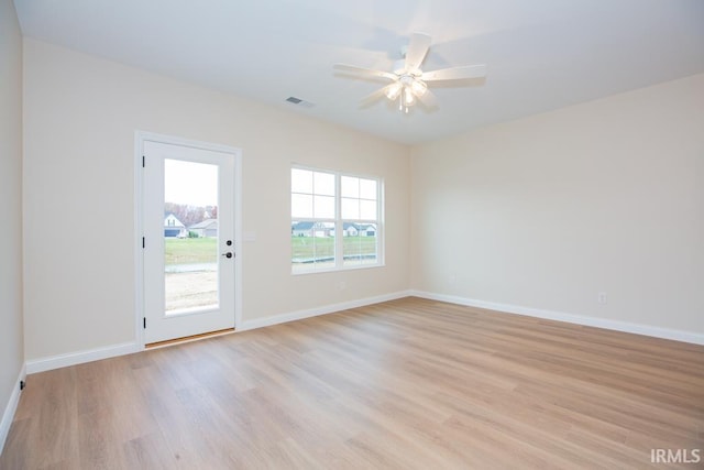 unfurnished room featuring ceiling fan and light hardwood / wood-style flooring