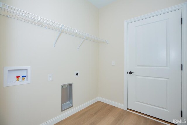 1609 Theo Dr Unit 2, Evansville, IN 47711 - laundry area featuring hookup for an electric dryer, hookup for a washing machine, and light hardwood / wood-style flooring