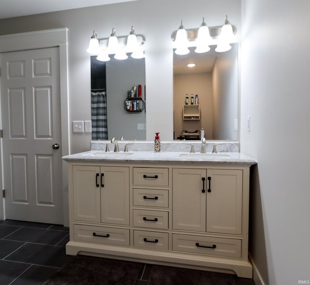 bathroom featuring tile patterned flooring and vanity