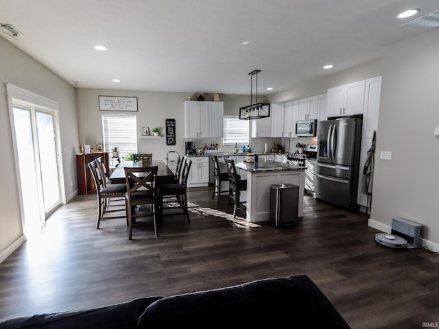 dining room with dark wood-type flooring