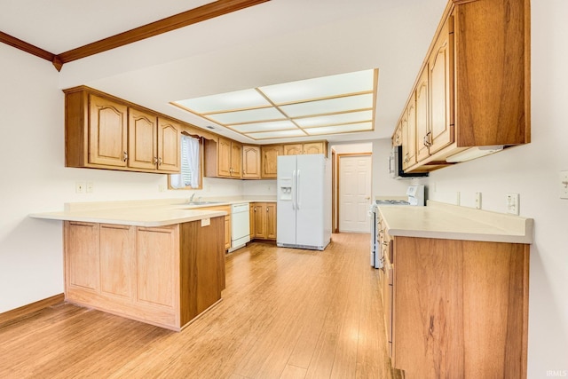 kitchen featuring kitchen peninsula, white appliances, crown molding, sink, and light hardwood / wood-style flooring