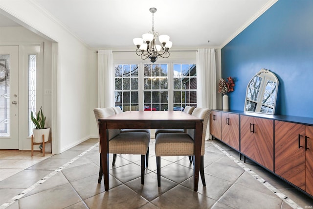 dining area featuring an inviting chandelier, ornamental molding, and light tile patterned flooring