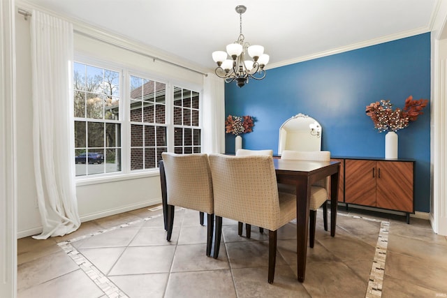 tiled dining area featuring crown molding and a chandelier