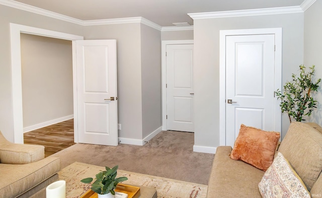 living room with carpet flooring and ornamental molding