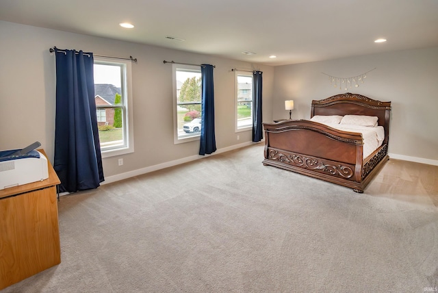 bedroom featuring light colored carpet