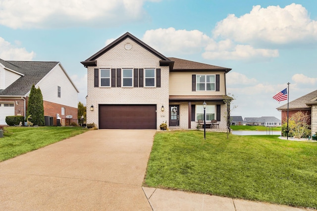 view of front of house featuring a garage, a front yard, and central AC