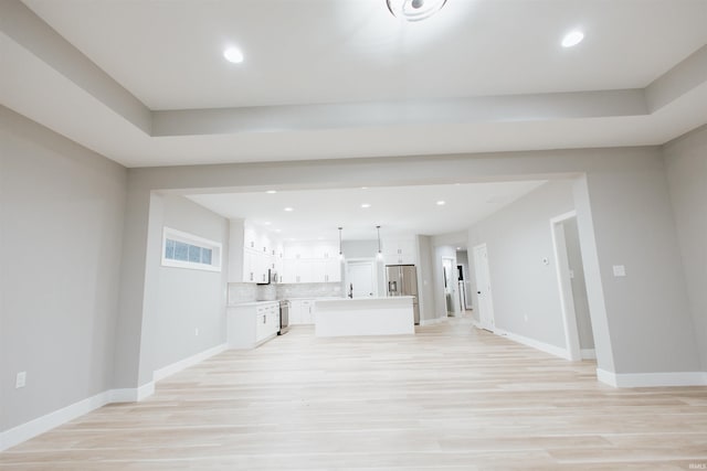 unfurnished living room with light hardwood / wood-style floors