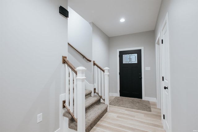 foyer entrance with light wood-type flooring