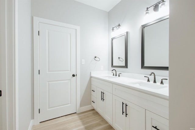 bathroom featuring hardwood / wood-style flooring and vanity