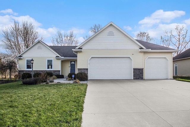 ranch-style house featuring a front yard and a garage