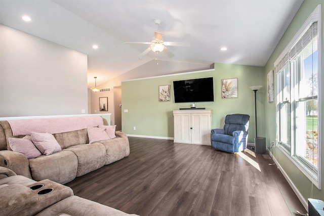 living room featuring ceiling fan, dark hardwood / wood-style floors, and vaulted ceiling