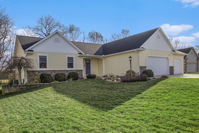 ranch-style home featuring a garage and a front lawn