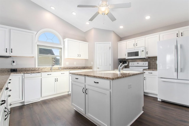 kitchen with white cabinetry, an island with sink, dark wood-type flooring, and white appliances