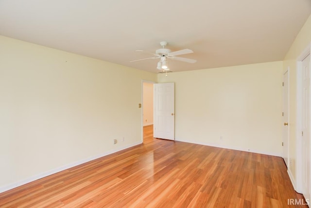 spare room featuring ceiling fan and light hardwood / wood-style floors