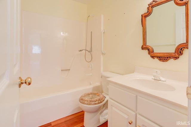 full bathroom featuring wood-type flooring, vanity, toilet, and shower / washtub combination