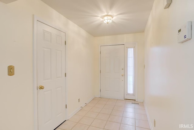 tiled entryway featuring a wealth of natural light