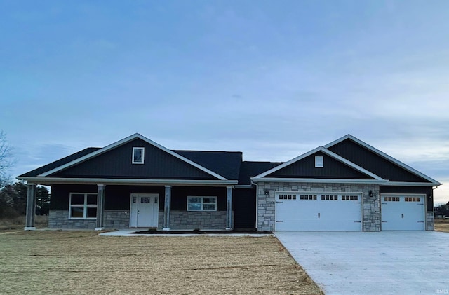 craftsman-style house with a porch and a garage