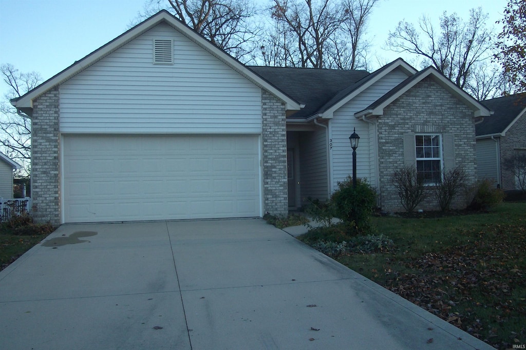 ranch-style house featuring a garage