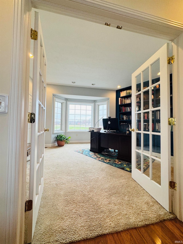 living room featuring french doors and hardwood / wood-style flooring