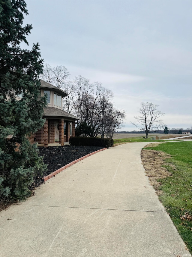 view of home's exterior with a lawn