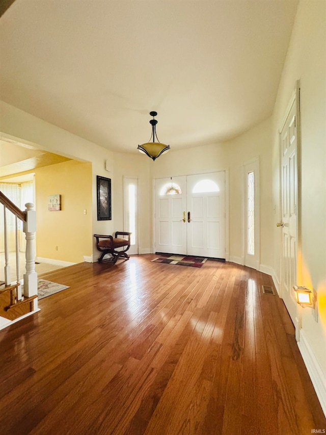 foyer with hardwood / wood-style flooring