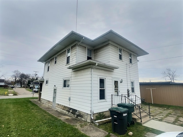 view of home's exterior featuring a lawn