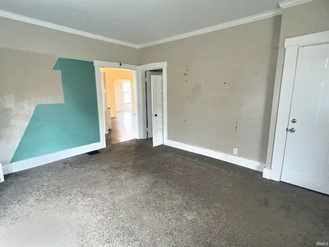 spare room featuring ornamental molding