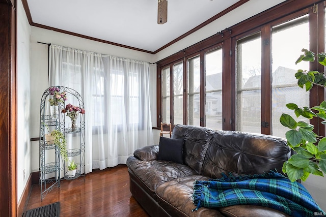 sunroom / solarium featuring ceiling fan