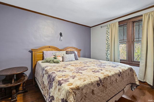 bedroom featuring dark hardwood / wood-style flooring and ornamental molding