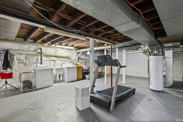 basement featuring separate washer and dryer and water heater