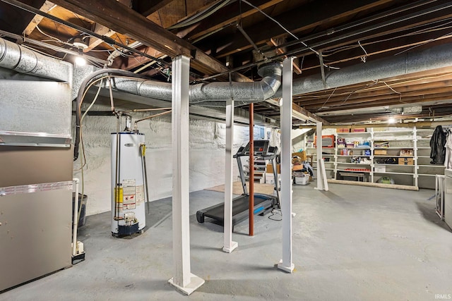 basement featuring gas water heater and heating unit