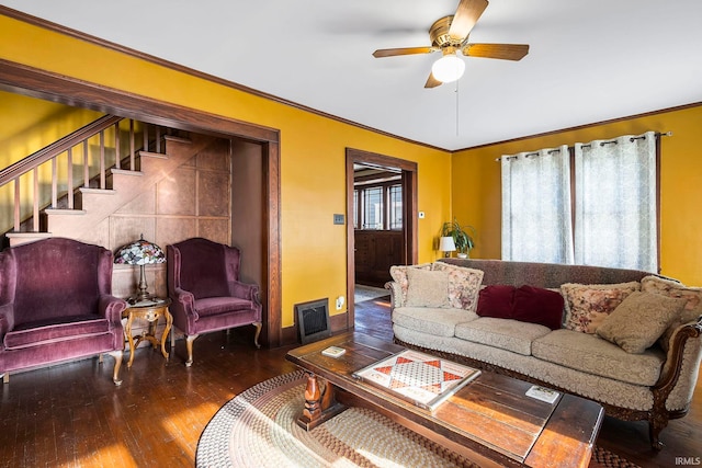 living room featuring ceiling fan, crown molding, and dark hardwood / wood-style floors