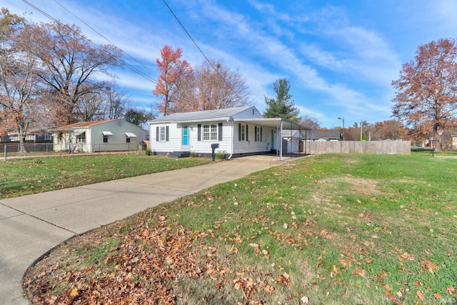 ranch-style house with a front lawn and a carport