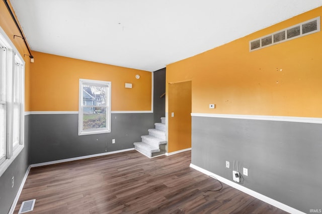 spare room featuring dark hardwood / wood-style floors