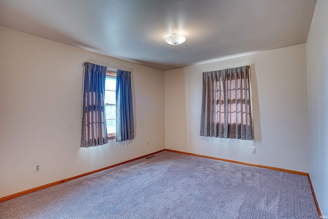 spare room featuring carpet floors