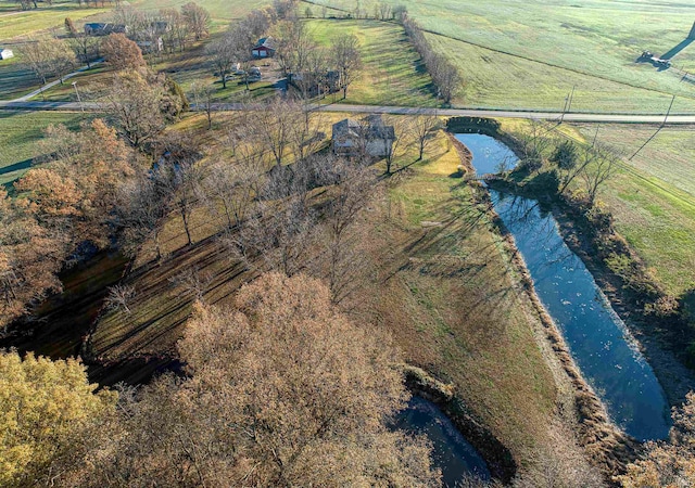 aerial view with a rural view and a water view