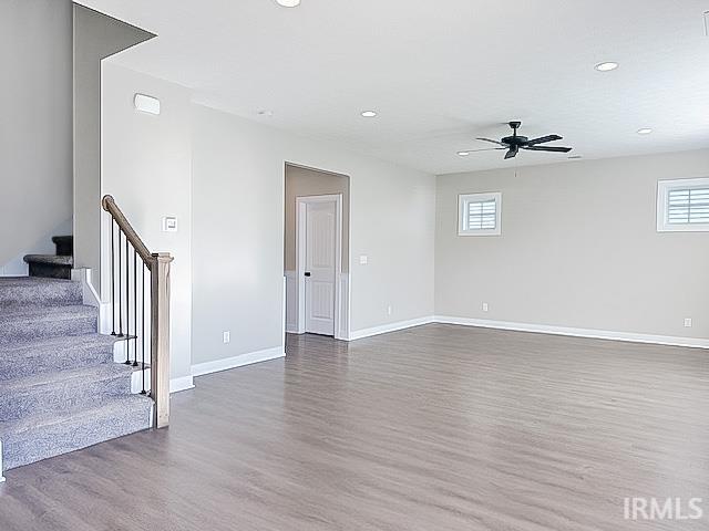 interior space with dark hardwood / wood-style floors and ceiling fan