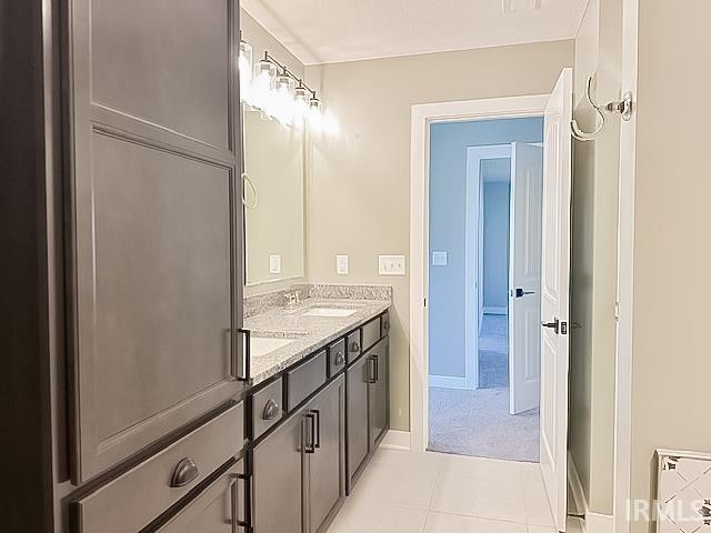 bathroom featuring tile patterned floors and vanity