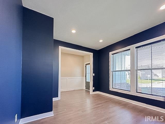 empty room with wood-type flooring