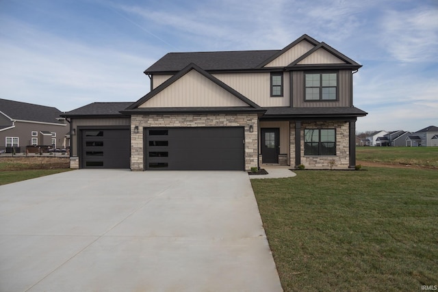 craftsman-style house featuring a garage and a front lawn