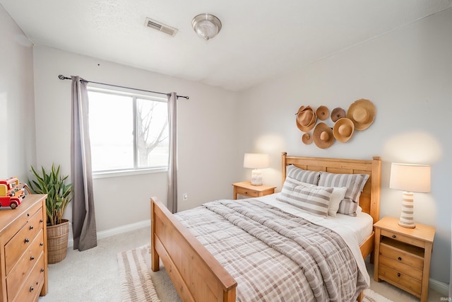 bedroom featuring light carpet