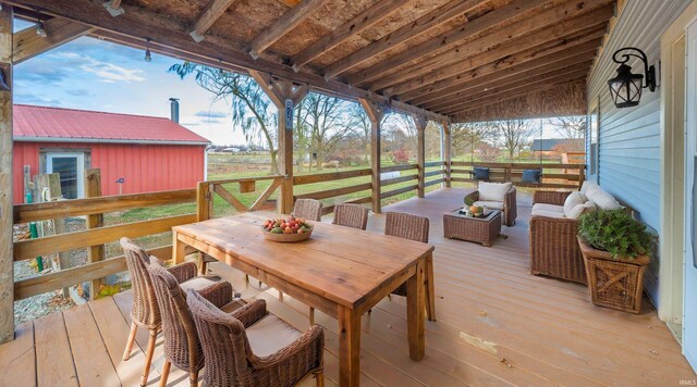 wooden terrace featuring an outdoor living space