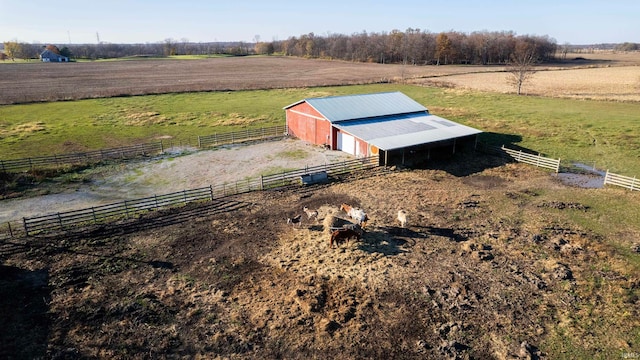 birds eye view of property featuring a rural view