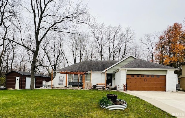 ranch-style home with a storage shed, a garage, and a front yard